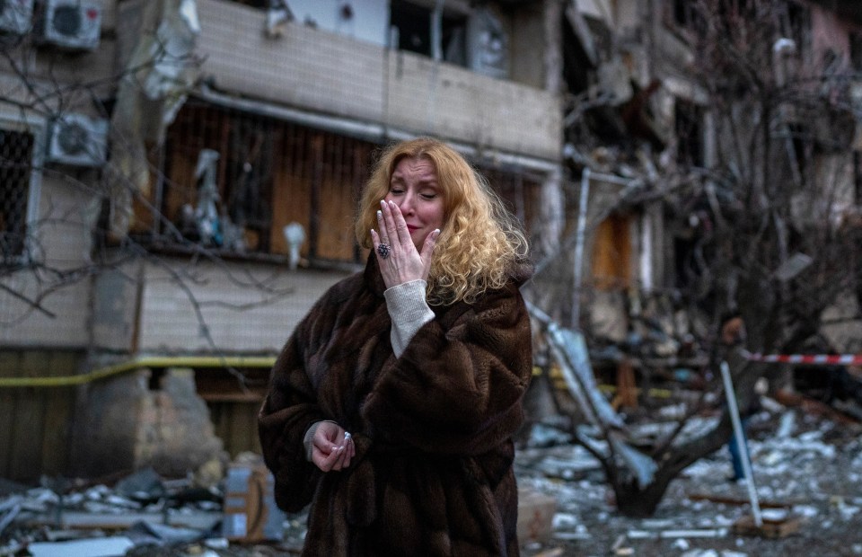 Natali Sevriukova is pictured weeping on the streets of Kyiv after a Russian rocket strike