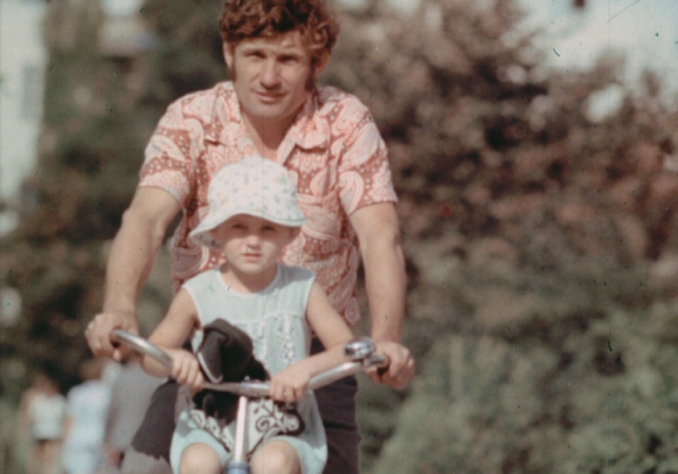 A dad enjoys a bike ride with his daughter in the aftermath