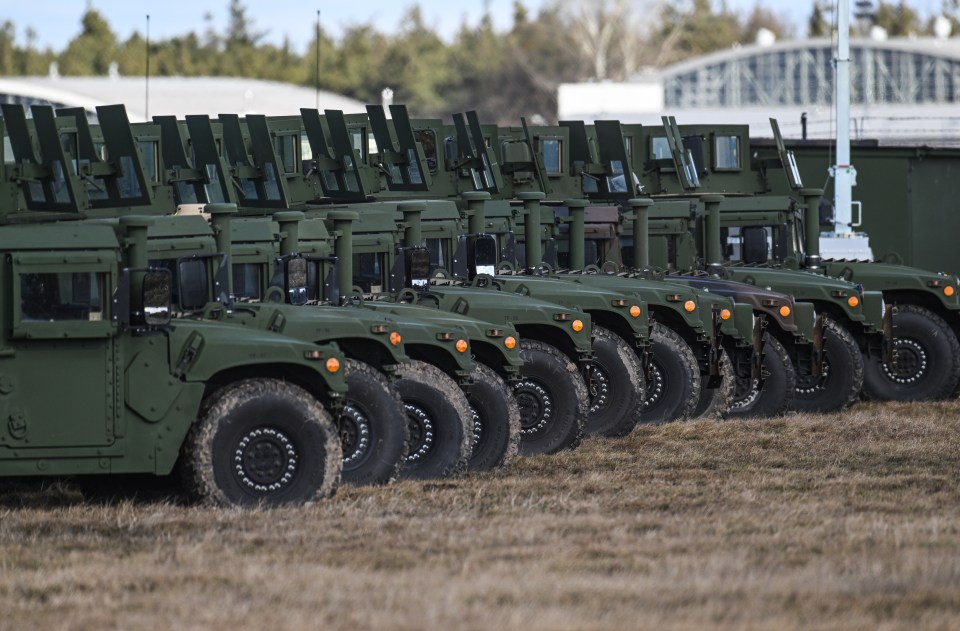 US military equipment and soldiers inside in a temporary base in Poland