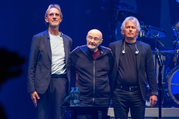 Mike Rutherford, Phil Collins and Tony Banks at the end of Genesis's last ever concert on Saturday night