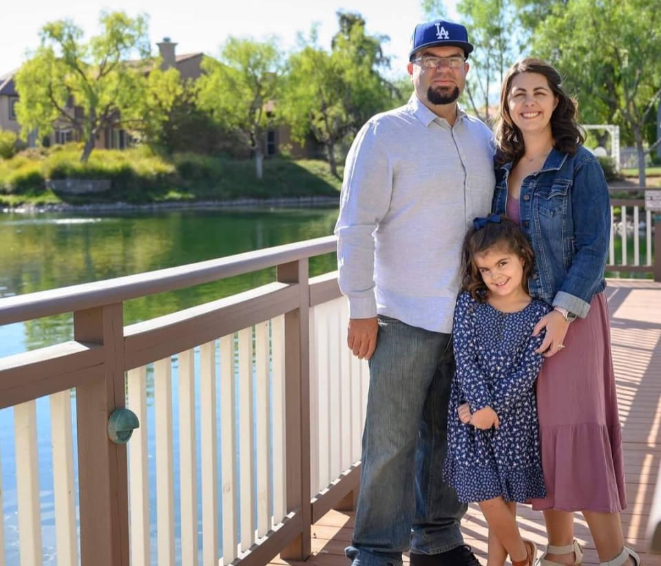 Mum Melissa Ursini first started to develop stomach cramps in January 2021 but put it down to normal female pains (above, Melissa, her husband Dominick and daughter Reagan)