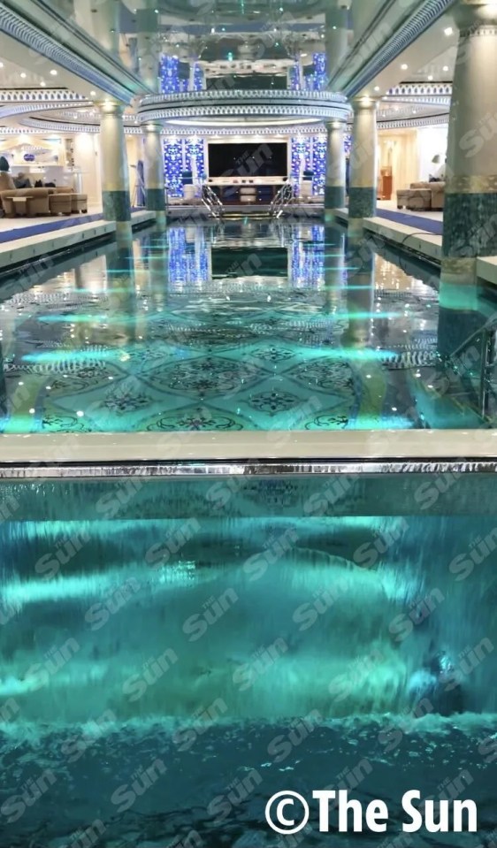 The tacky floating palace, currently in Hamburg, boasts a 30m indoor pool, lined with blue crystals and adorned by palatial columns