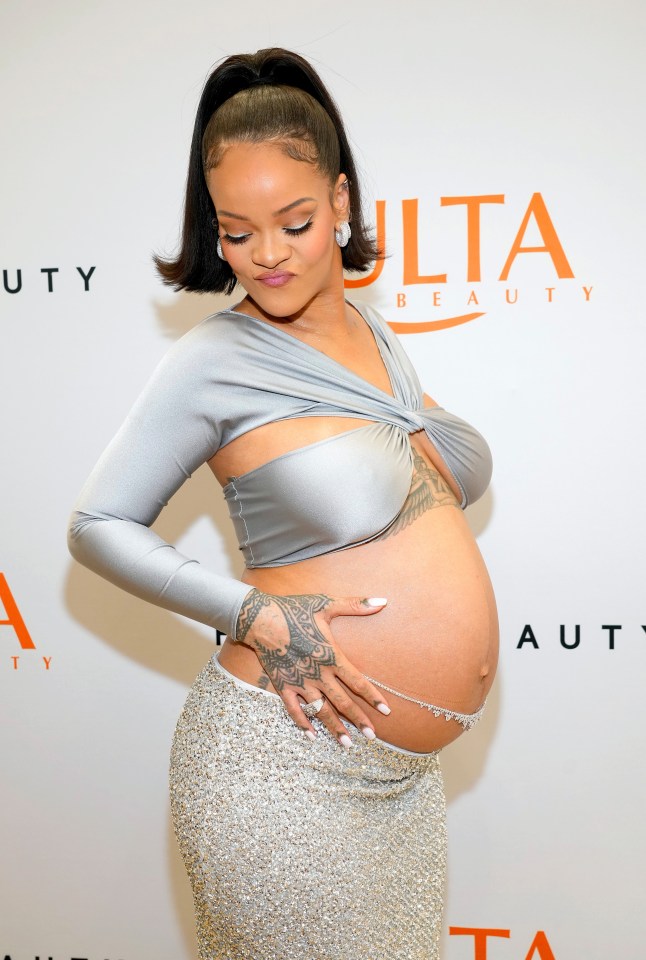 Rihanna showed off her growing baby bump in a silver ensemble last month