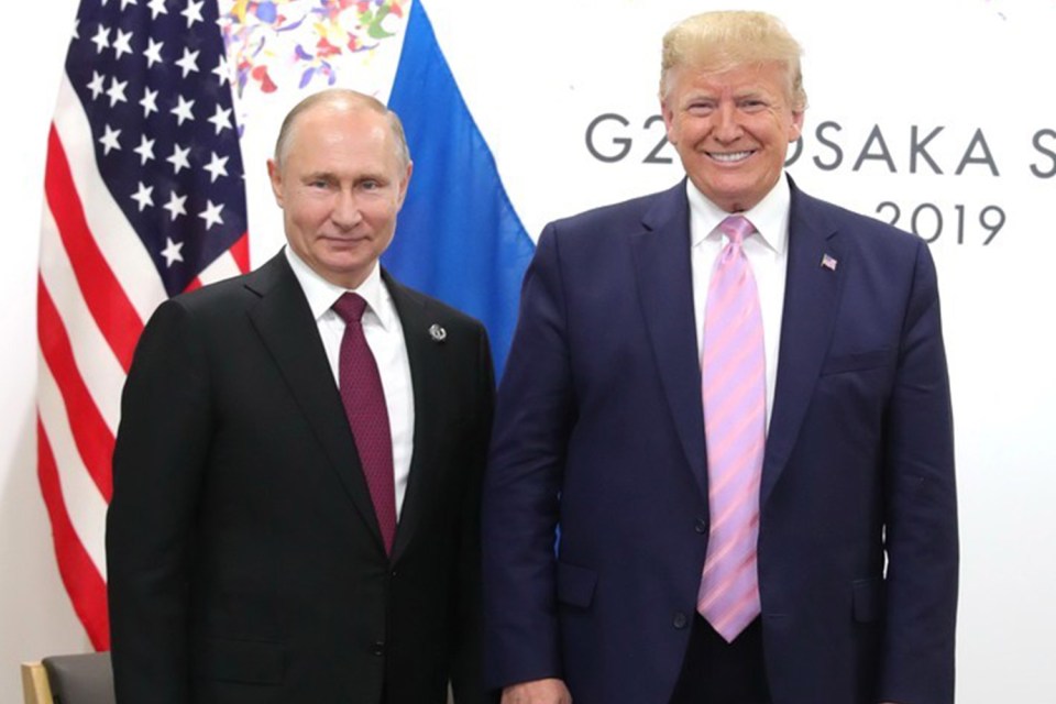 Trump and Putin standing together.