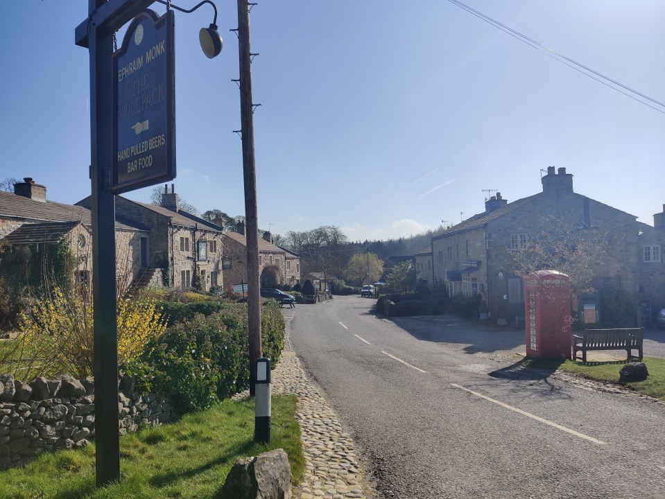 Main Street in Emmerdale with the village's only phone box