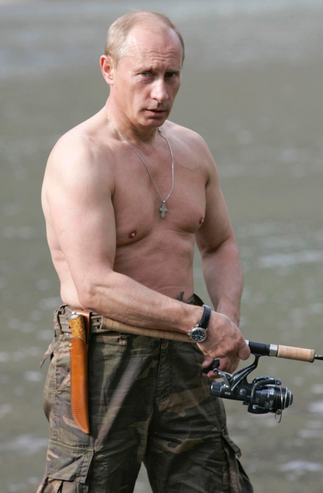 a shirtless man is holding a fishing rod