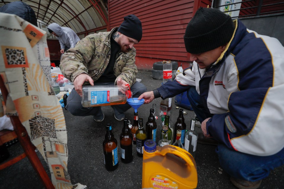 Kyiv residents make Molotov cocktails ahead of the Russian attack