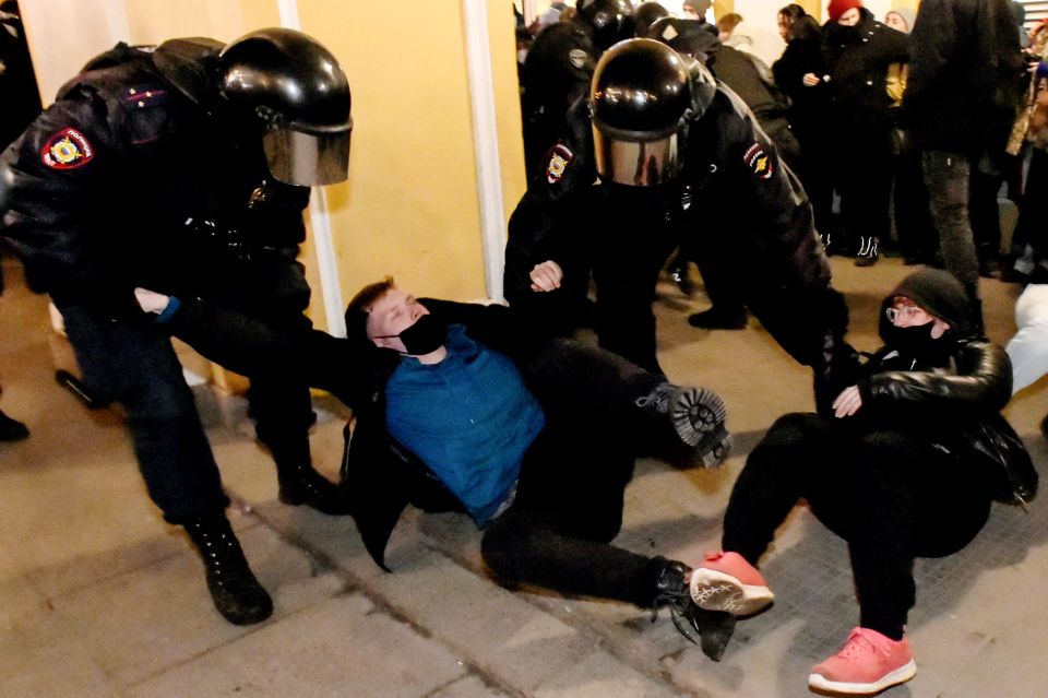 Police detain a demonstrator during a protest against Russia's invasion of Ukraine in Saint Petersburg