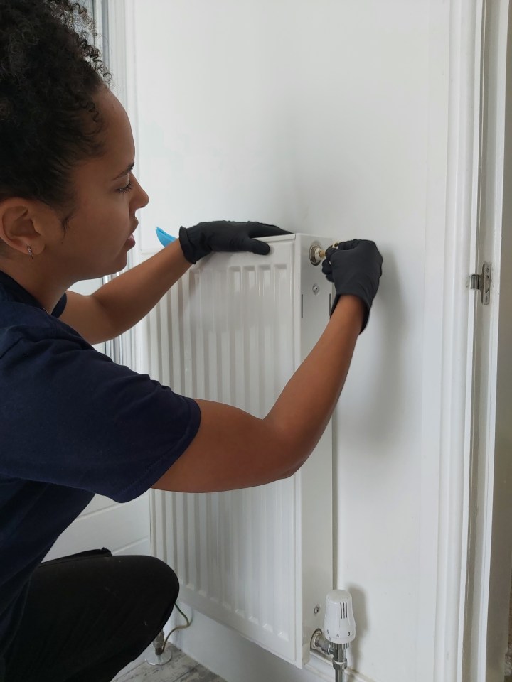 Leah at work fitting a radiator