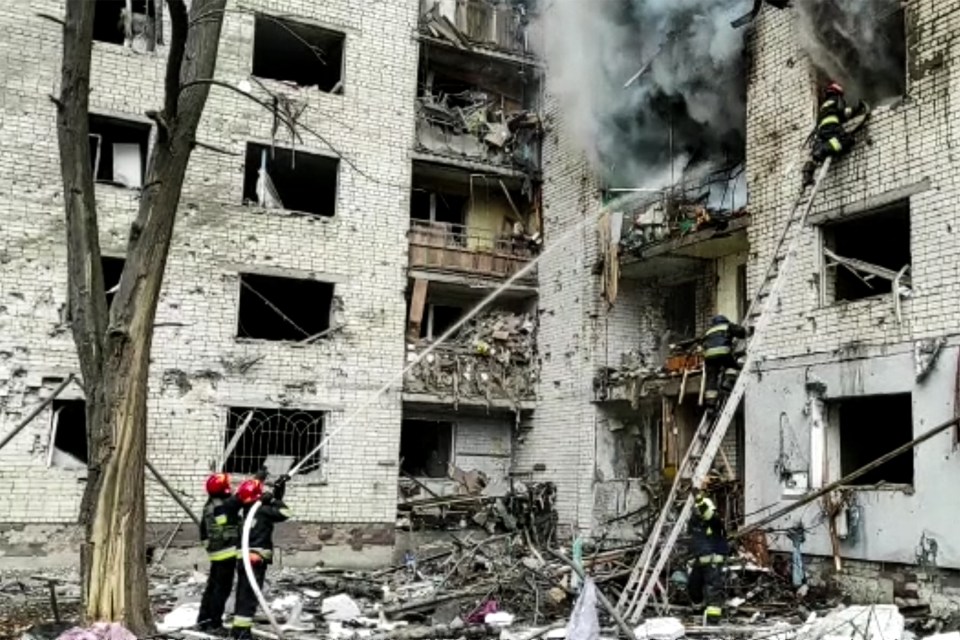 Firefighter trying to tackle flames after one airstrike