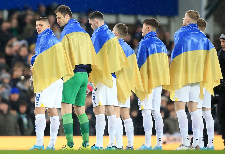 Everton's Ukrainian defender Vitaliy Mykolenko led out his team in his country's flag ahead of the 2-0 FA Cup win over Boreham Wood