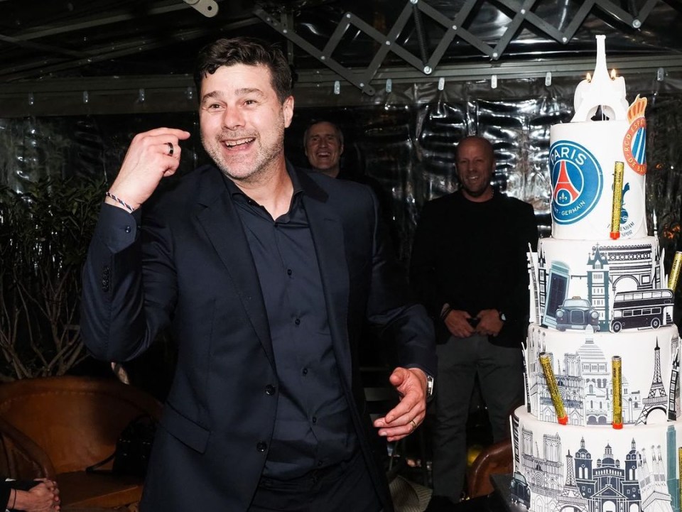 The PSG boss was also presented with a towering cake featuring the club's emblem