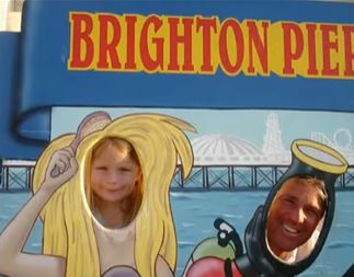 The 52-year-old pictured with one of his beloved daughters on Brighton Pier