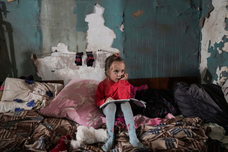 A child takes shelter in the besieged city of Mariupol