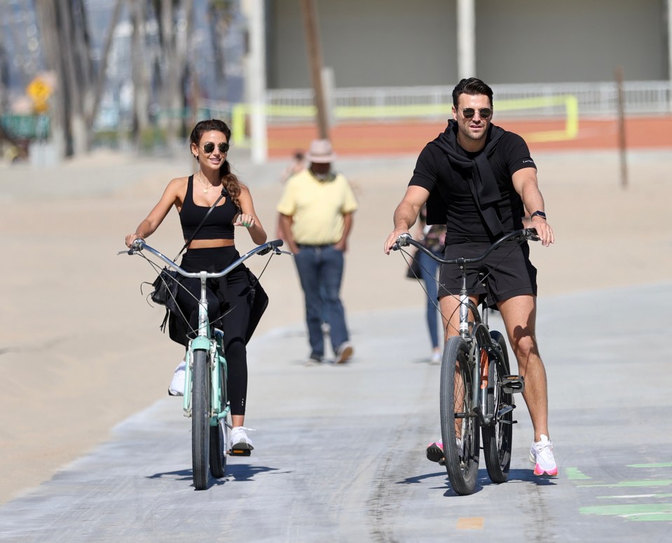 The pair were all smiles as they cycled along the tourist hot spot