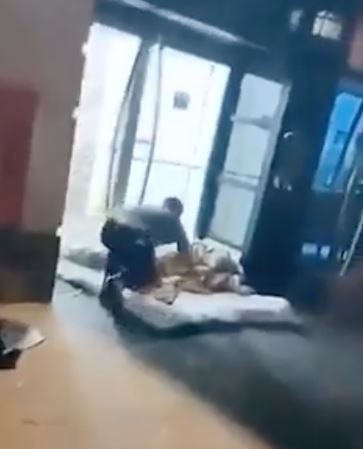 The 22-year-old was filmed approaching the rough sleeper in Cardiff