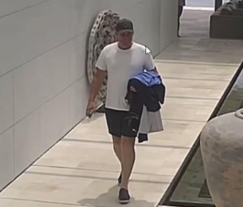 A CCTV image taken just hours before Shane Warne's death shows him walking back to his villa