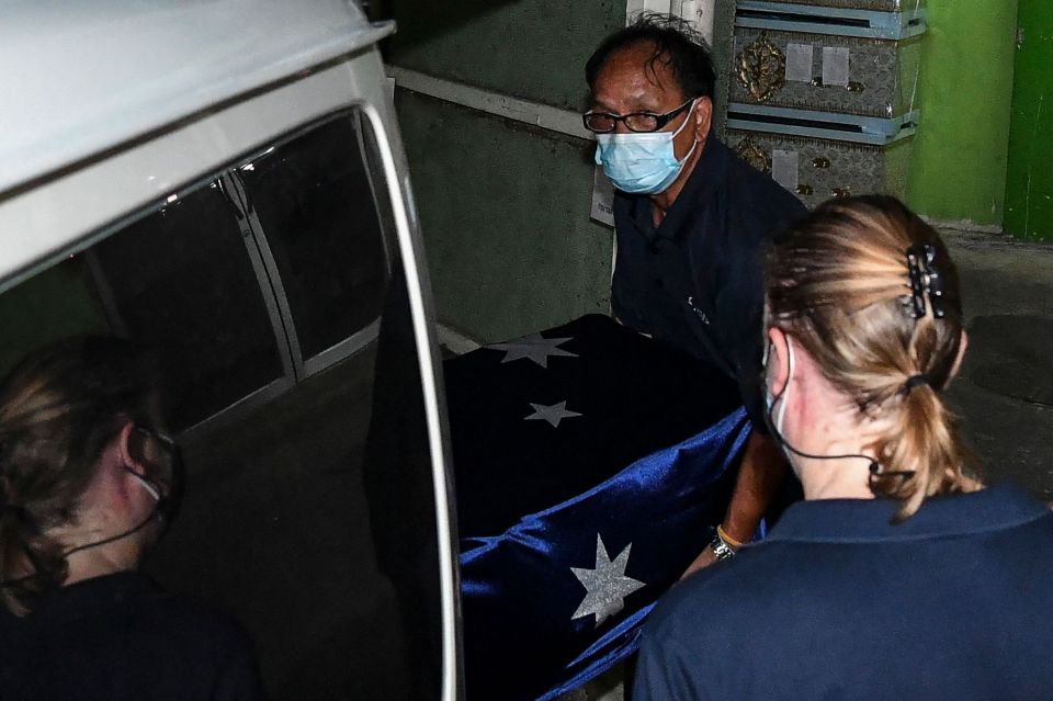 Shane Warne's coffin is loaded into a vehicle bound for the airport and flight home to Australia