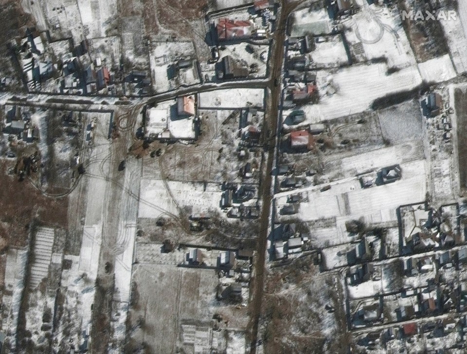 Military equipment is pictured being moved into position just miles from Kyiv