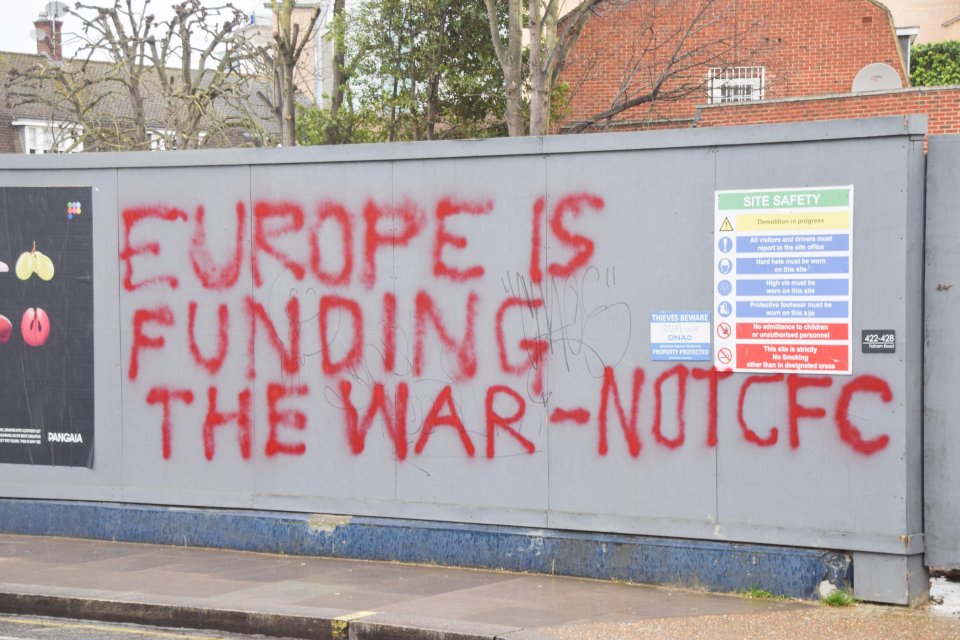 Graffiti from Chelsea fans outside Stamford Bridge condemned the UK government's decision