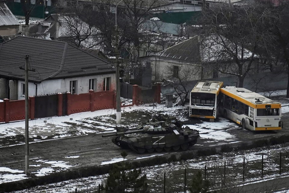 A Russian army tank moves on the outskirts of Mariupol, Ukraine