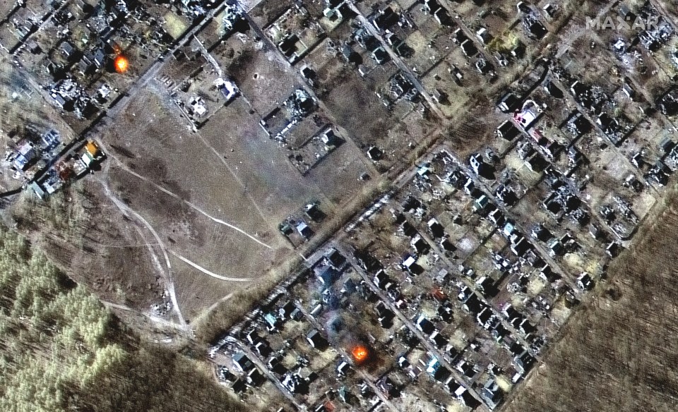 A satellite image from Maxar Technologies appears to show burning homes in the town of Moschun