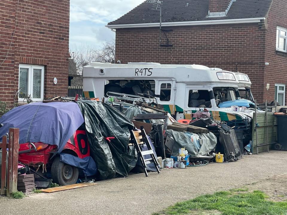 He has kept broken down cars and appliances in his front garden