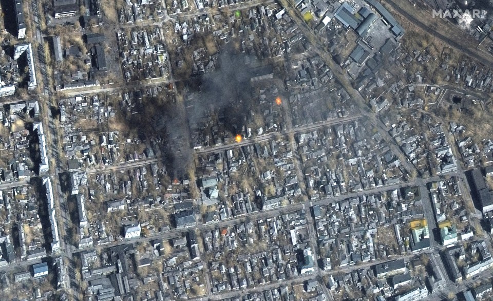 A satellite image shows buildings burning near Fontanna street in eastern Mariupol