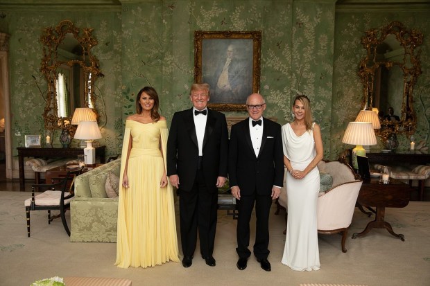 Johnson with his pals Donald and Melania Trump and his wife Suzanne