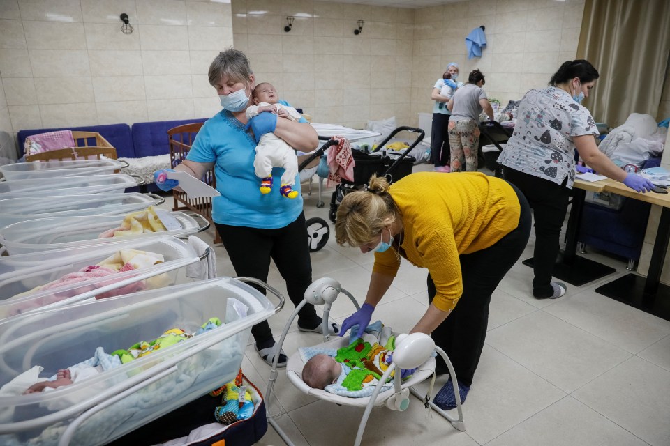 Nurses looking after the tots in a residential basement as the Russian invasion continues