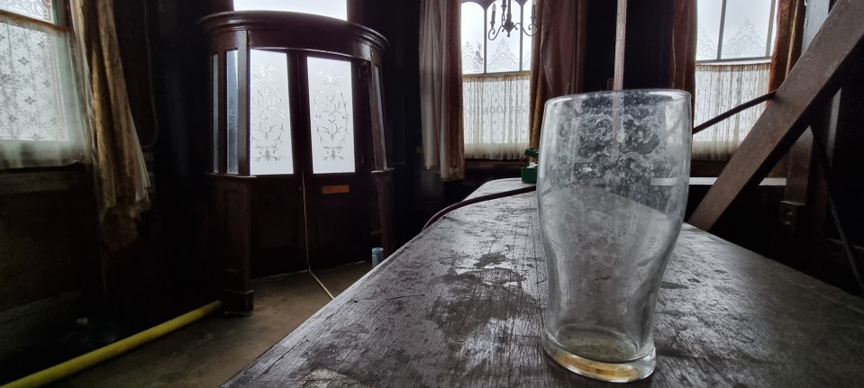 A mucky pint glass is seen on the side