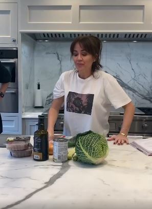 The kitchen boasts white marble work surfaces