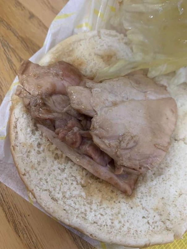 Another pictures claims to show the inside of an unsightly chicken roll served up at the school