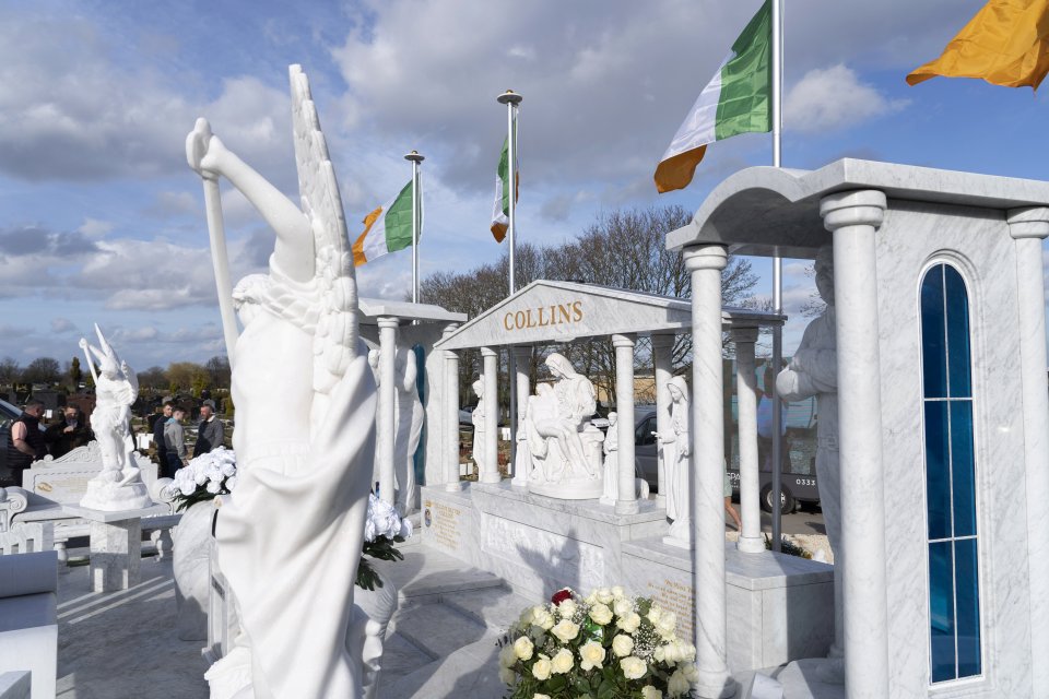 The grave in Sheffield features ornate religious statues and Irish flags