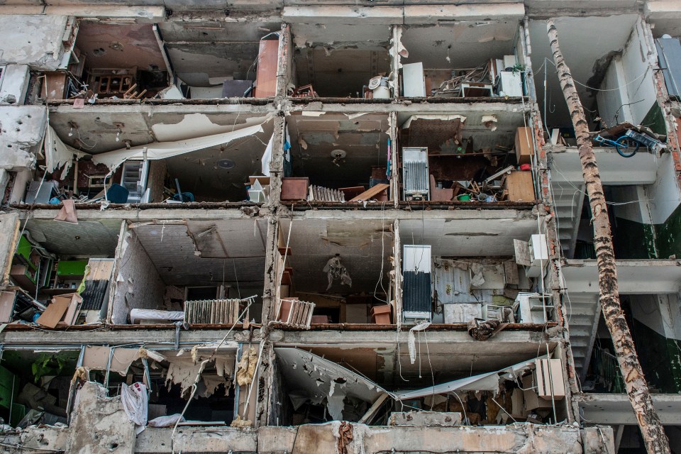 An apartment building in the city had its side completely ripped off by Russian shelling