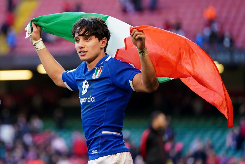 The players proudly paraded the Italian flag on the pitch after the game