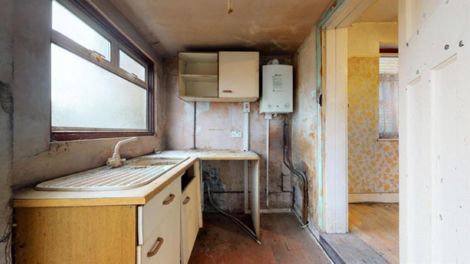 While the bathroom is especially grimy, every other space - including the kitchen and the bedrooms - will also need lots of work