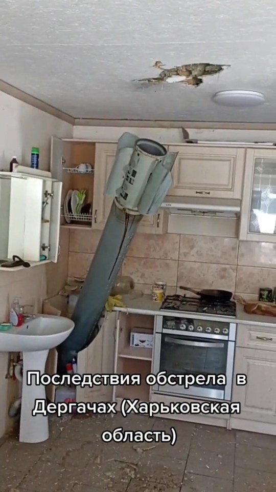 An unexploded Russian missile is pictured after crashing through a kitchen ceiling in Kharkiv