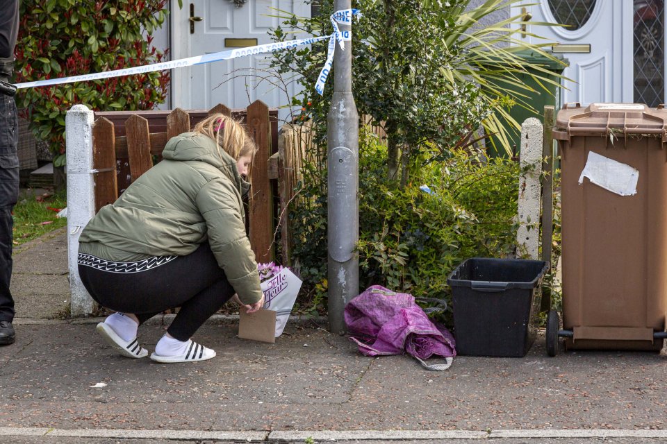 People laid flowers outside the home