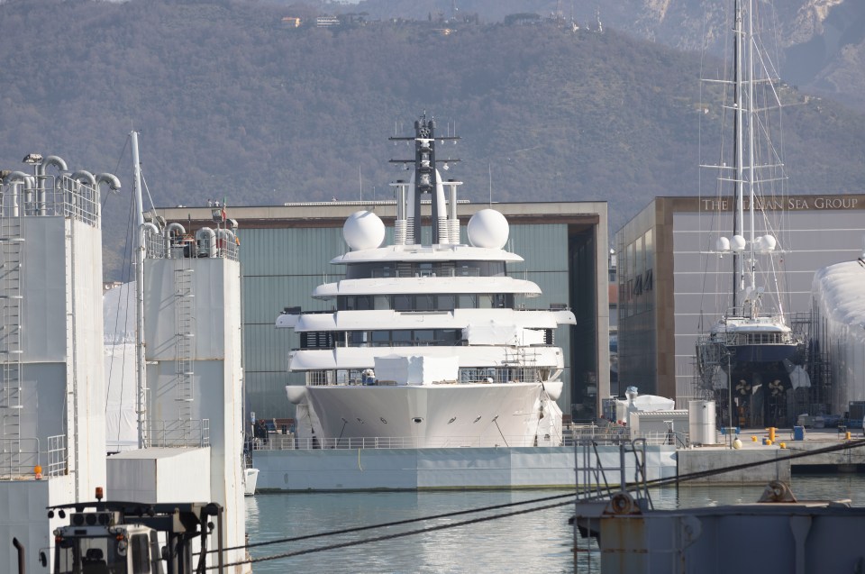 Vladimir Putin's megayacht Scheherazade pictured stuck behind steel dry dock gates in Marina di Carrara, Italy