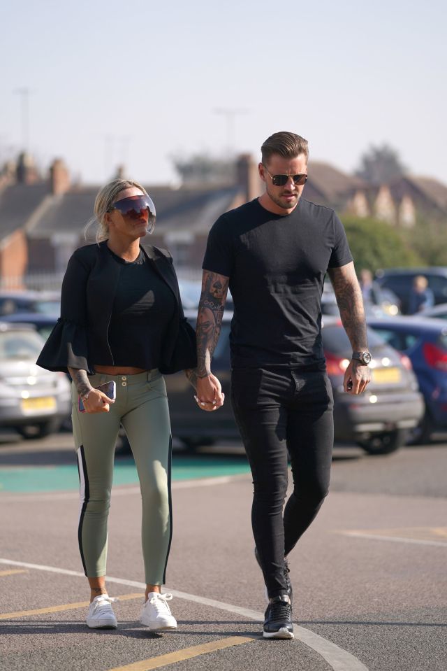 Katie arrived hand in hand with fiance Carl Woods