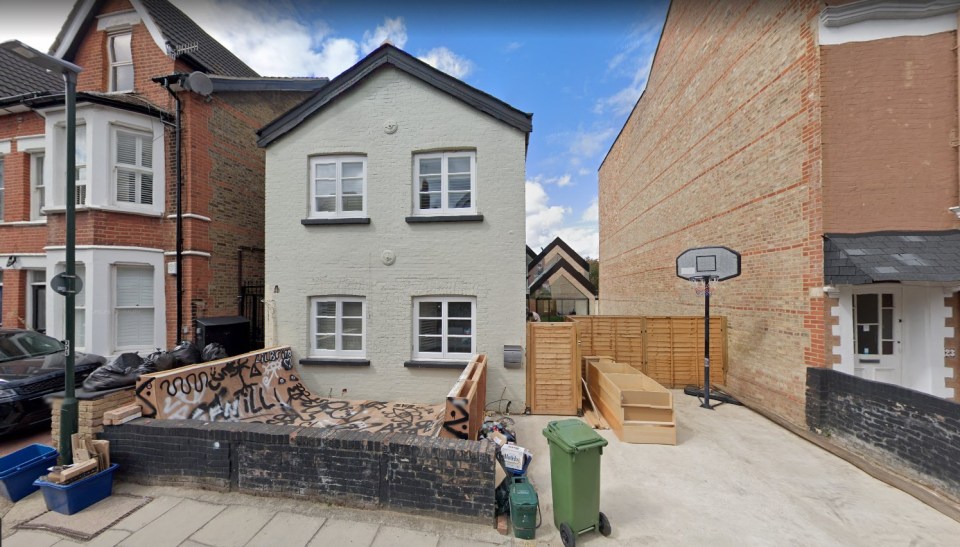 The house appears like any other on the street - with a cream finish and skateboard ramp in the front yard