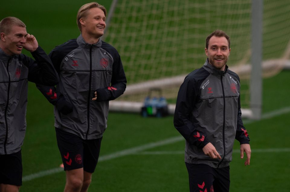 Eriksen was snapped smiling during Denmark training