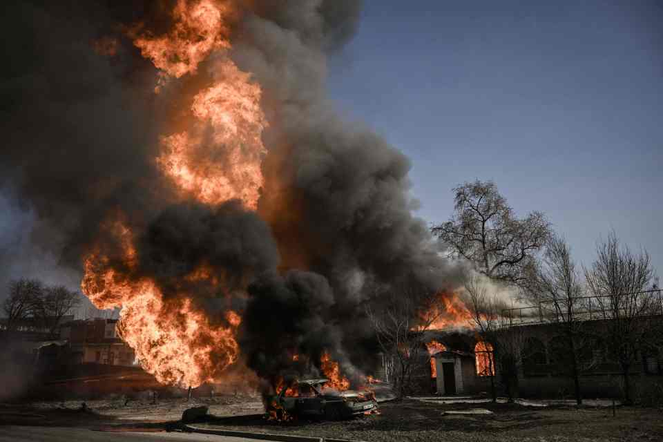 Flames and smoke rise from a fire on the 30th day of the invasion of Ukraine by Russian forces in the northeastern city of Kharkiv