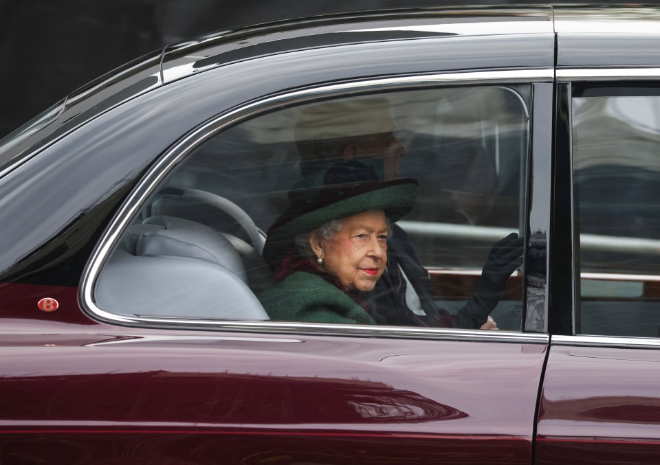 The Queen waved to royal supporters as she was driven to a separate entrance