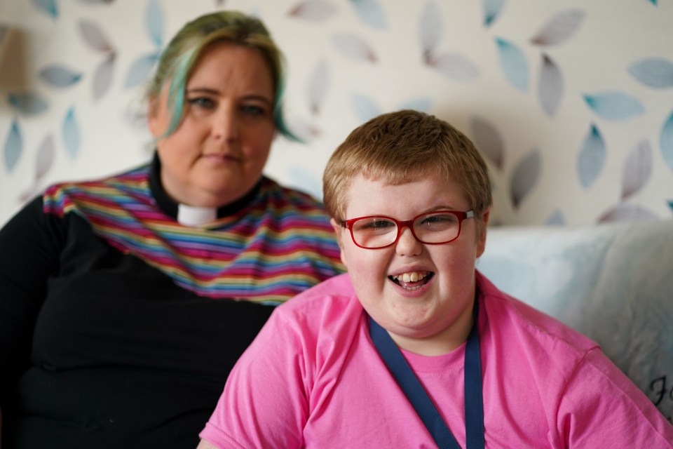 Rev Charlotte Cheshire with her son Adam Cheshire at their home in Newport, Shropshire