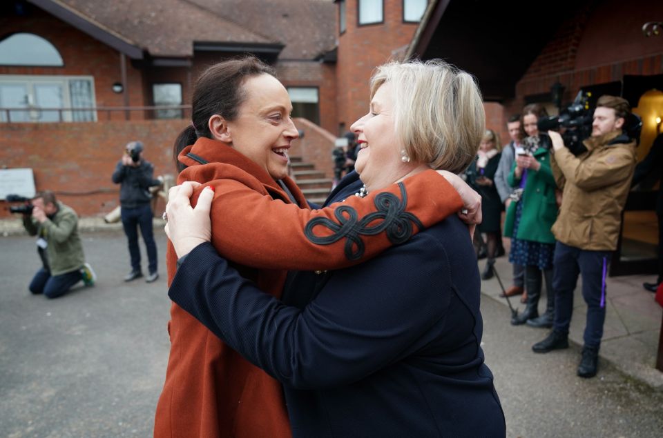 Rhiannon Davies embraces Ms Okenden after the release of the report