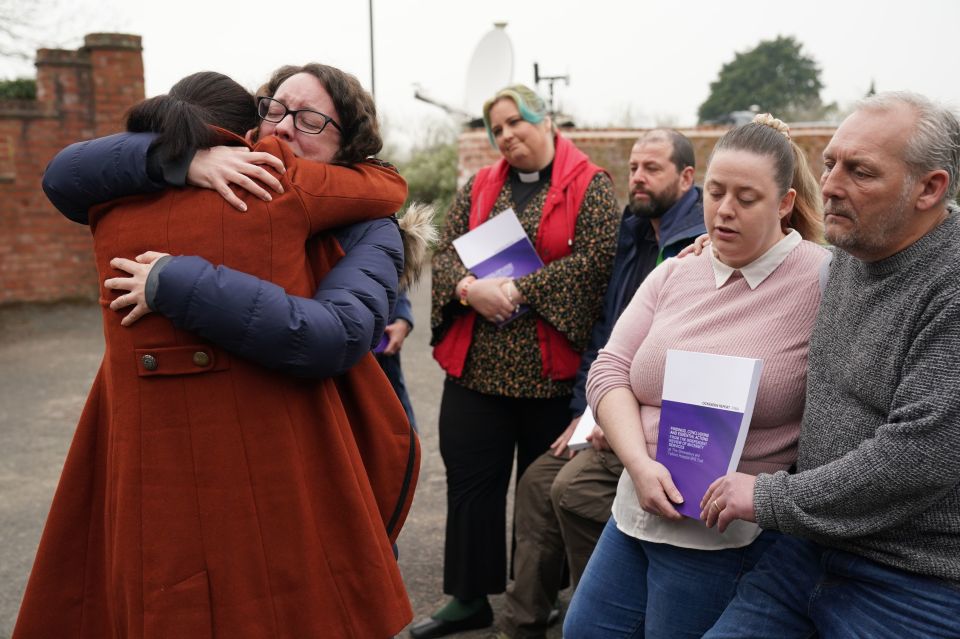 Rhiannon Davies embraces Kayleigh Griffiths after they both pushed for a probe