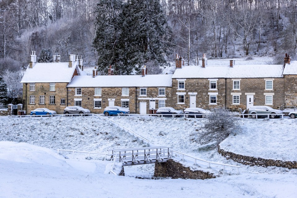 The snow covered village of Hutton Le Hole in Yorkshire after heavy snow fall this morning