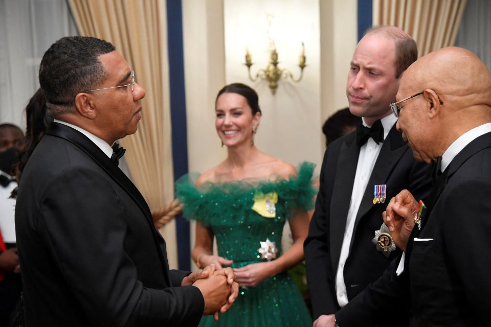 The Duke and Duchess of Cambridge (centre) talk with Jamaica's Prime Minister Andrew Holness (left) and the Governor General of Jamaica Patrick Allen (right)